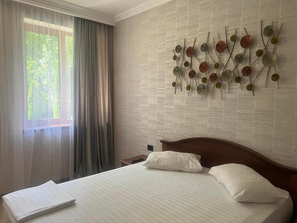 Postel nebo postele na pokoji v ubytování Park Avenue Hotel Yerevan