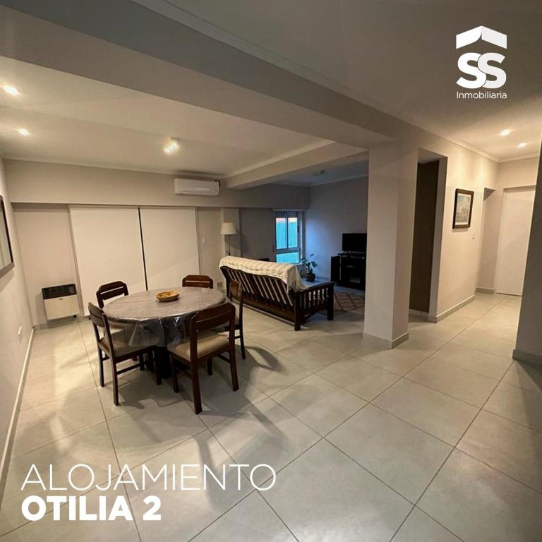 a dining room with a table and chairs in a room at OTILIA 2 in Libertador San Martín