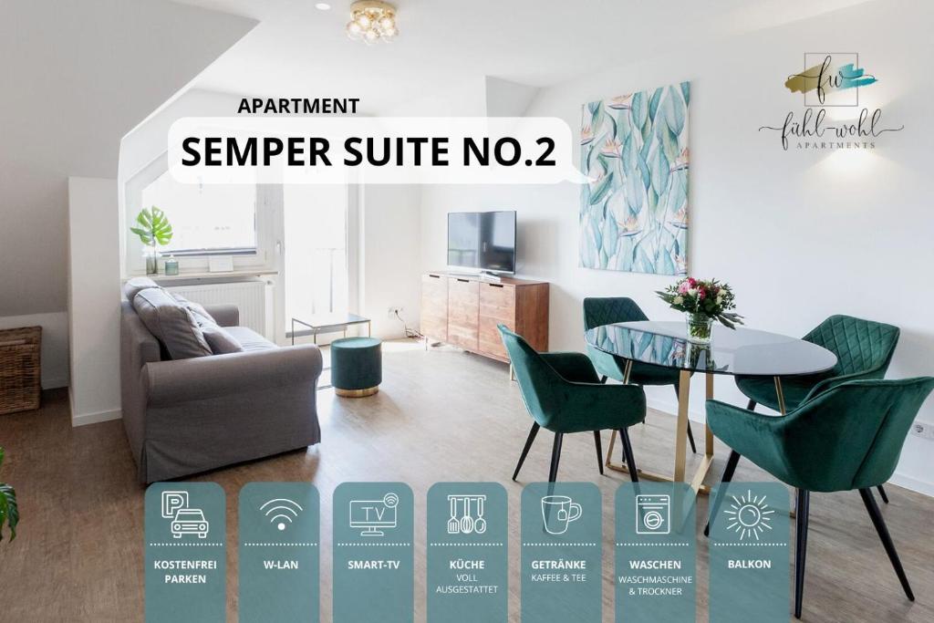 バイロイトにあるSemper Suite No2 - Ruhige 2 Zi FeWo 1-4 Pers mit Küche, Duschbad, Balkon und Parkplatz in Hofgartennäheのリビングルーム(テーブル、緑の椅子付)