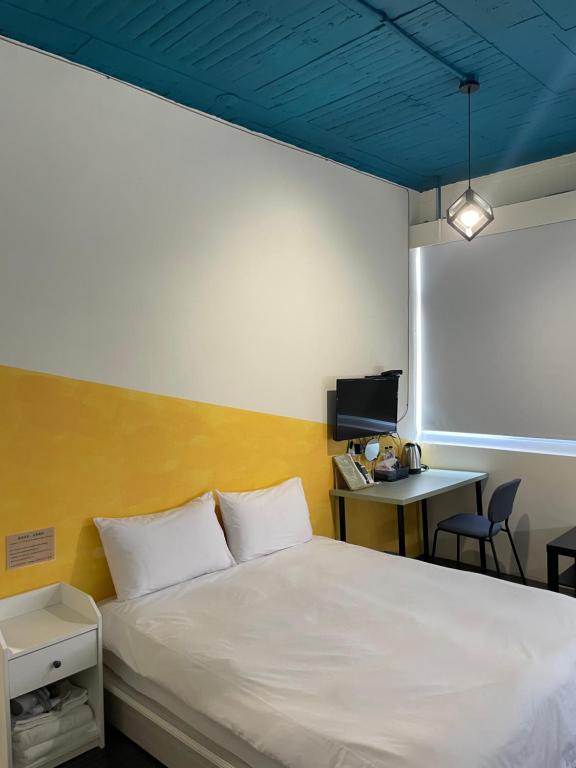 Letto o letti in una camera di 好客輕旅