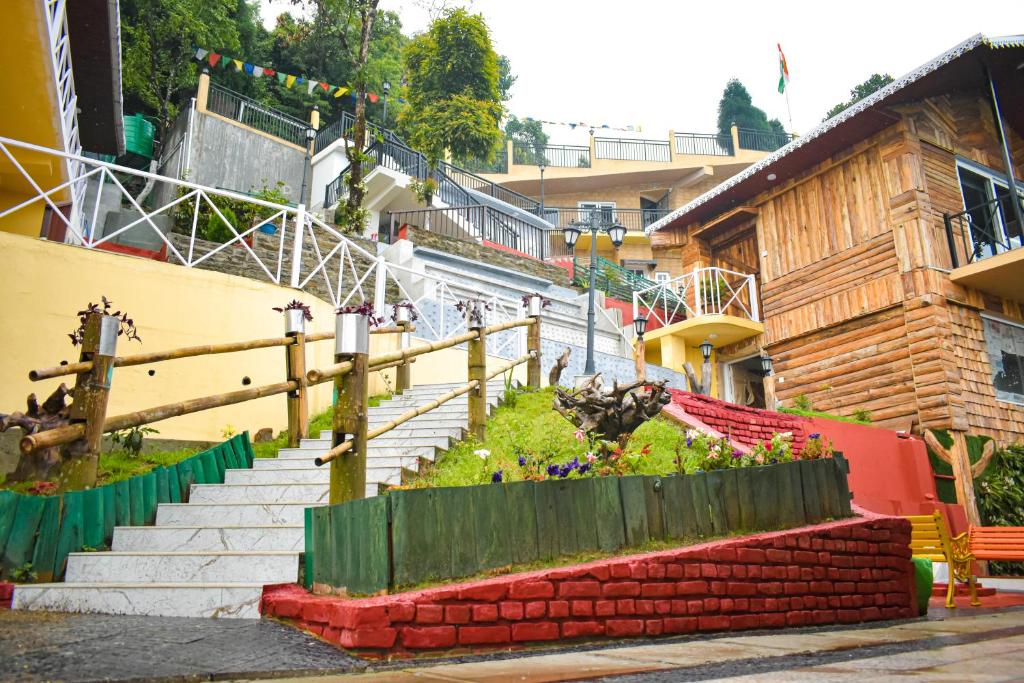 a set of stairs with people walking down them at La Das Treetops in Kurseong