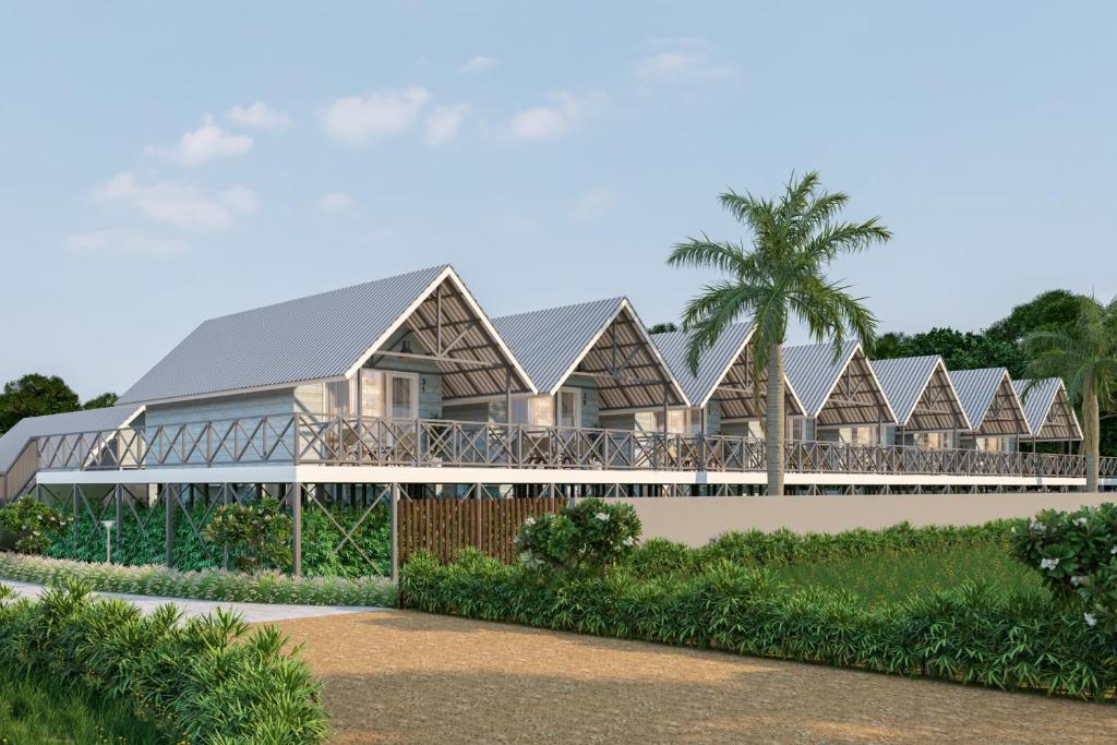 a rendering of a resort with a row of houses at Praveg Beach Resort Daman, Jampore Beach in Daman