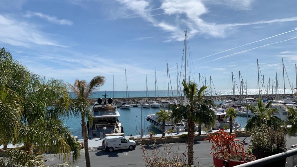 a marina with a bunch of boats in the water at Luxury Apartment San Lorenzo al Mare in San Lorenzo al Mare