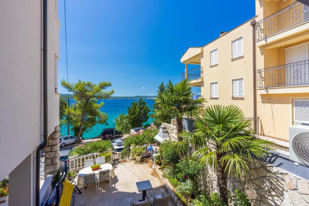 an apartment balcony with a view of the ocean at Villa Lucia 2 in Dramalj