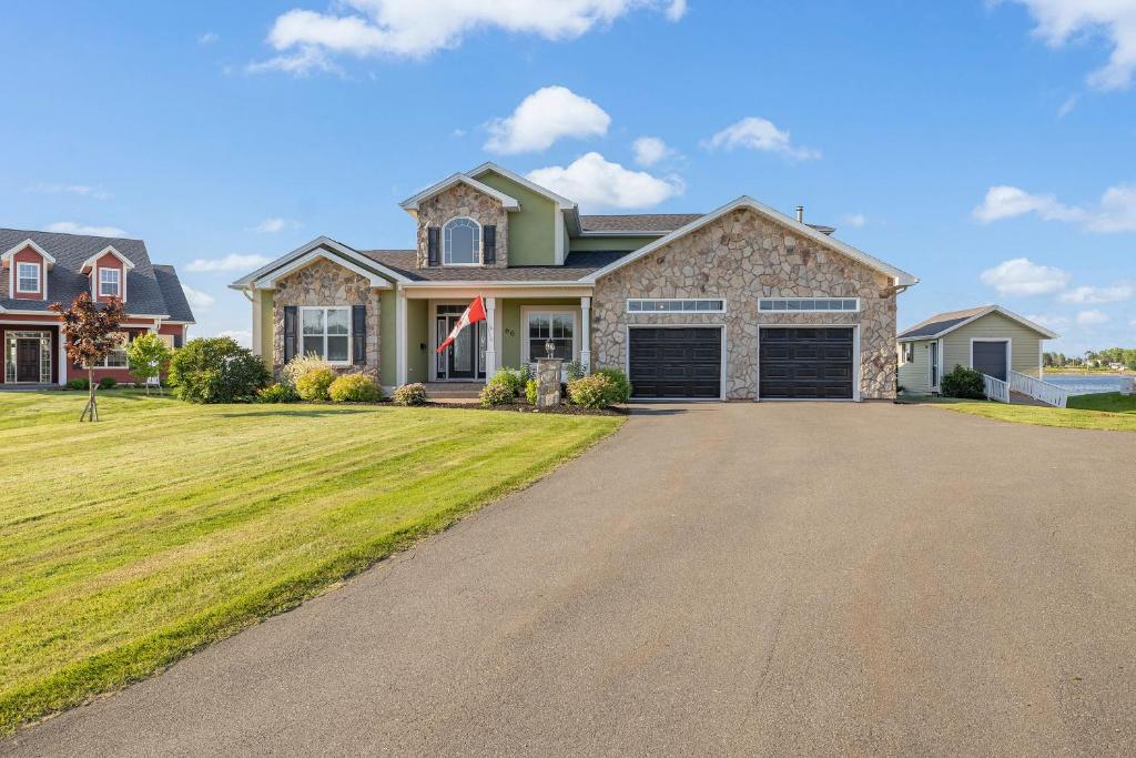 a large house with a driveway in front of it at Harbour View Haven in Stratford