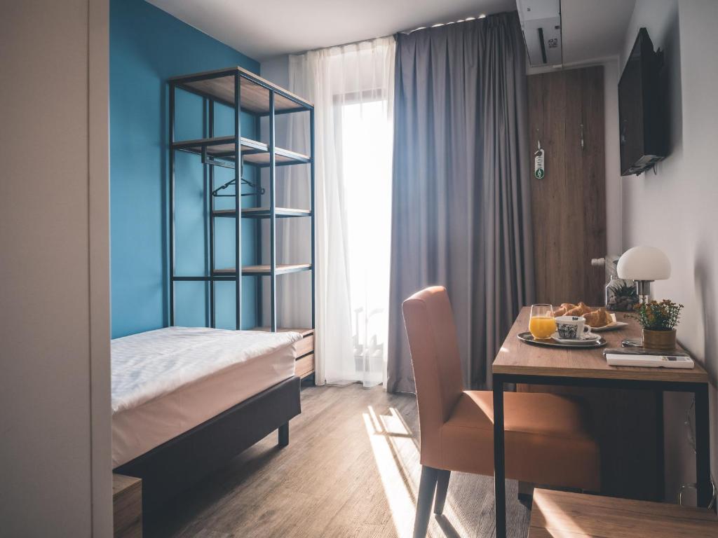 Postel nebo postele na pokoji v ubytování Sabotin, Hotel & Restaurant