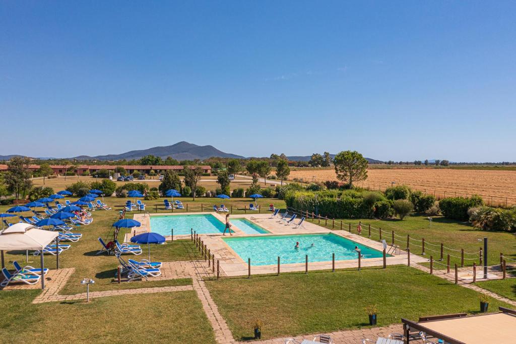 an aerial view of a pool at a resort at Residenza Principina in Principina Terra