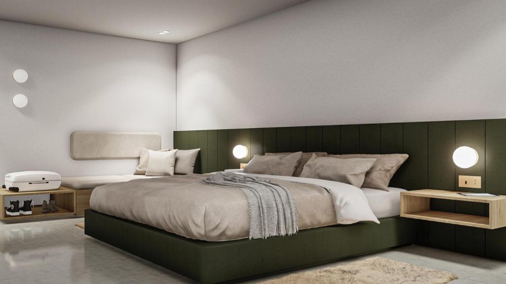 オーランドにあるOrlando Vitality Hotelのベッドルーム1室(緑のヘッドボード付きの大型ベッド1台付)