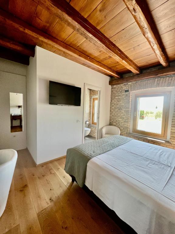 Postel nebo postele na pokoji v ubytování B&B La Corte Dei Vizi