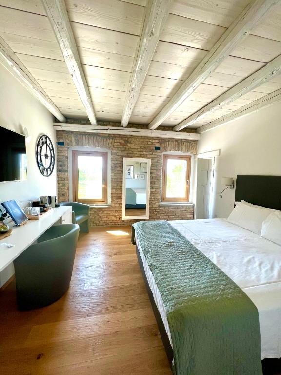 Postel nebo postele na pokoji v ubytování B&B La Corte Dei Vizi