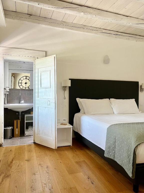 Postel nebo postele na pokoji v ubytování B&B La Corte Dei Vizi