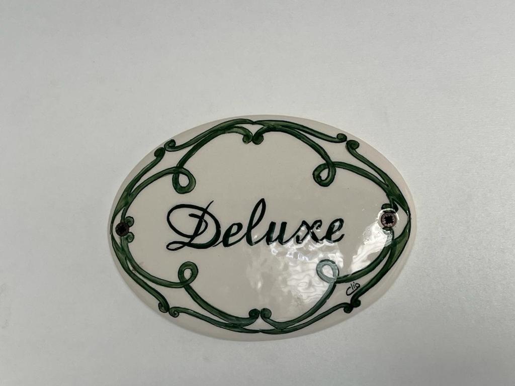a sign with the word beluce in a circle at Althea in Viareggio