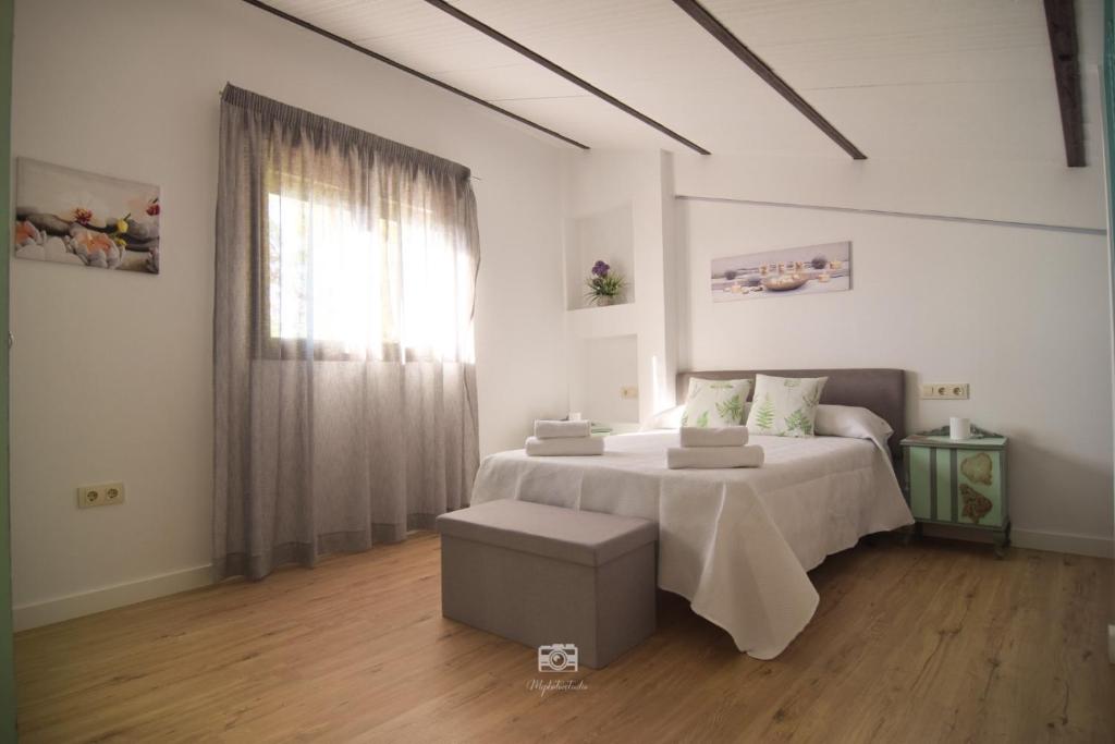 Ένα ή περισσότερα κρεβάτια σε δωμάτιο στο Vivienda Turísiica Murallas de Arjona