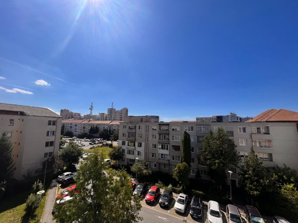 an aerial view of a parking lot with buildings at Apartament central Milea in Sibiu