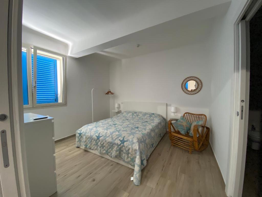 מיטה או מיטות בחדר ב-Gemma Mediterranea