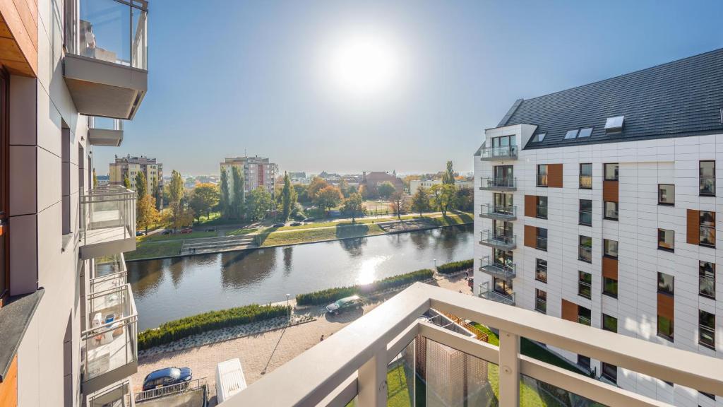 a view of a river from the balcony of a building at City Center SPA Apartments Jaglana 6A with Parking in Gdańsk