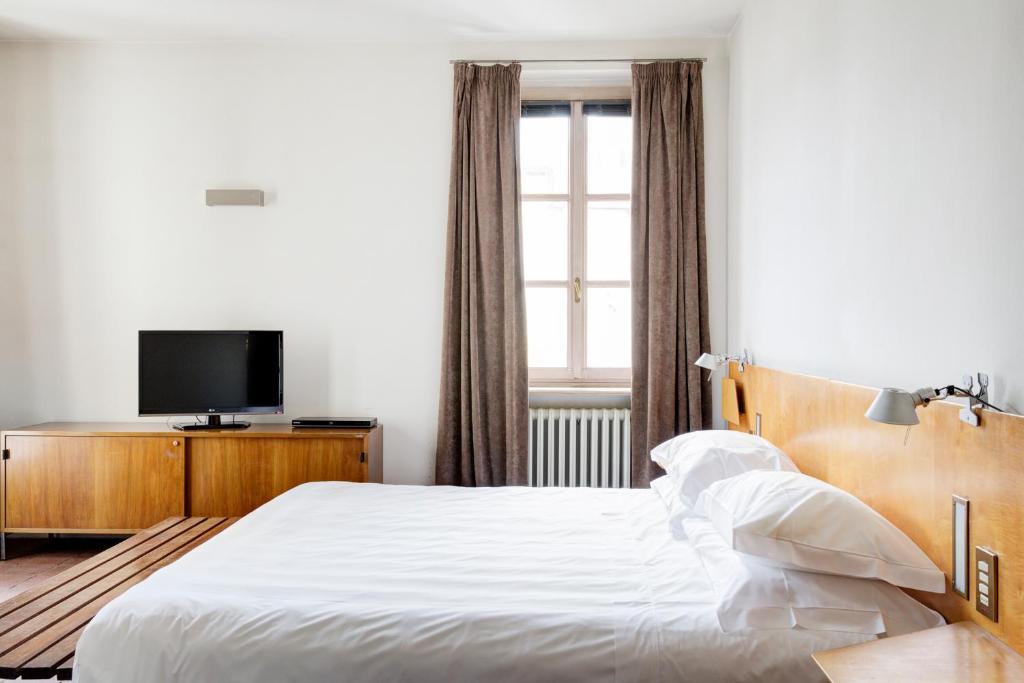 Postel nebo postele na pokoji v ubytování Casa del Pingone