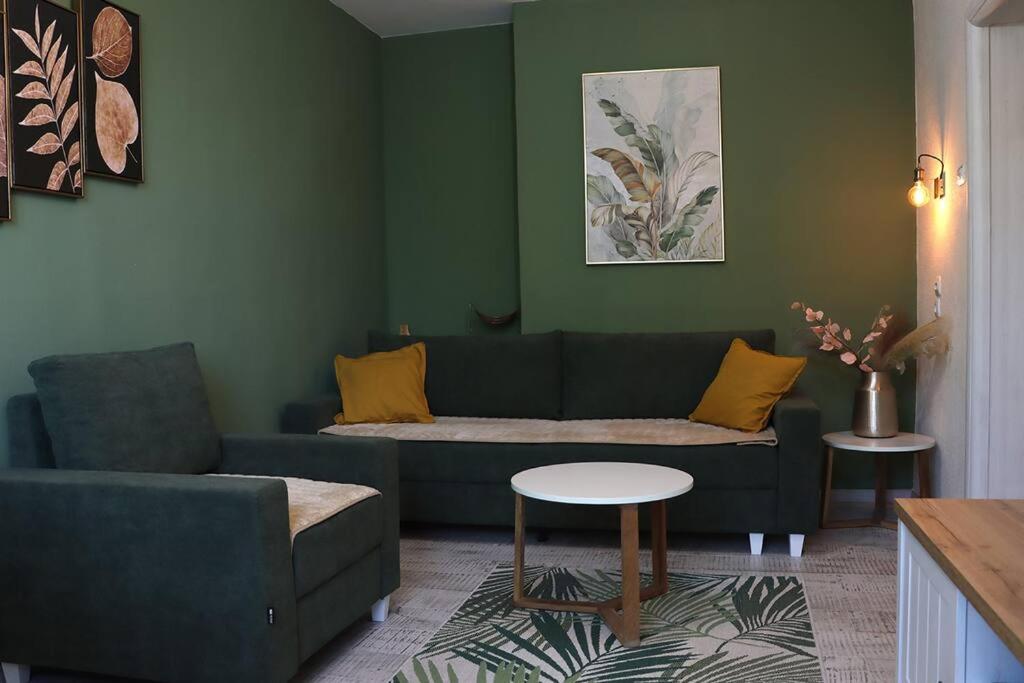 a living room with a couch and a table at Platanus in Trebinje