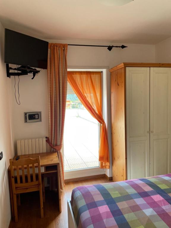 Postel nebo postele na pokoji v ubytování Hotel Culmine