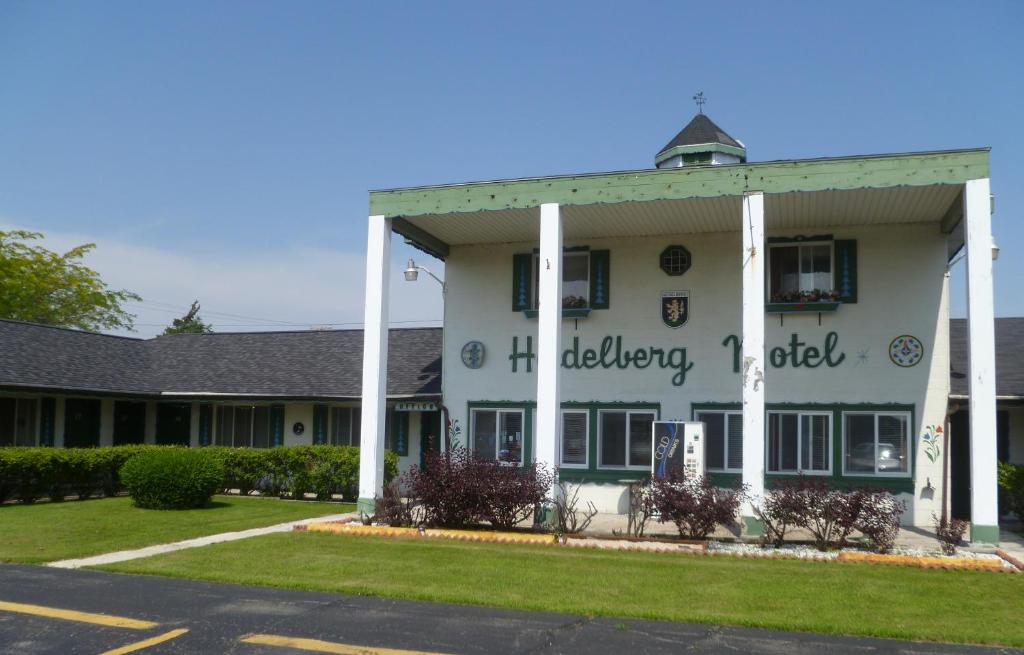 a large white building with writing on the side of it at Heidelberg Motel in Bridgeport