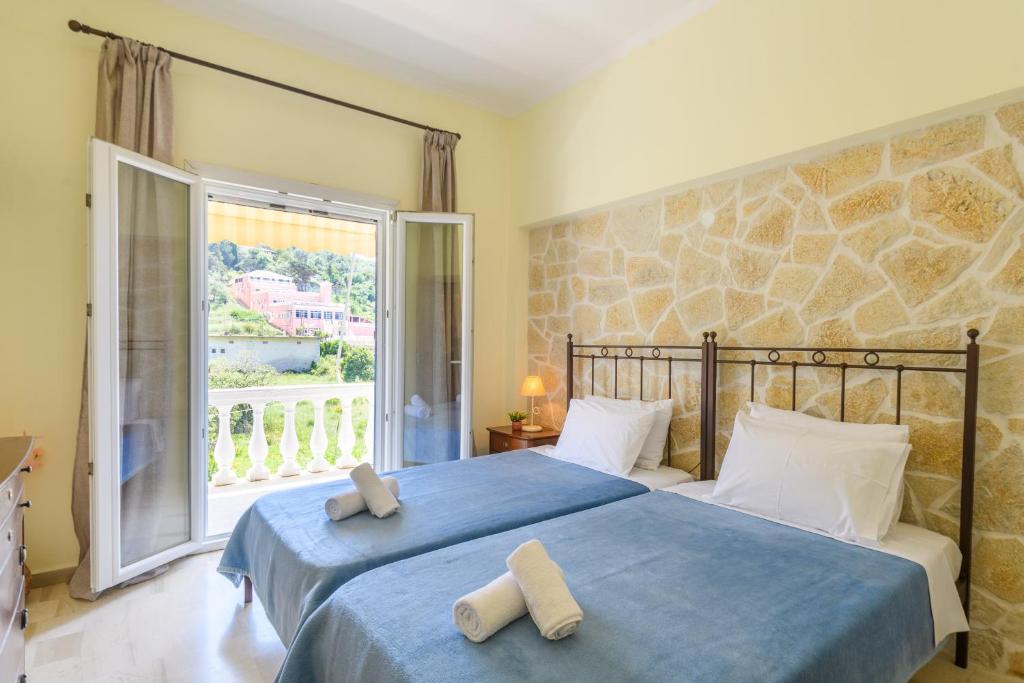 Кровать или кровати в номере Delfini Resort