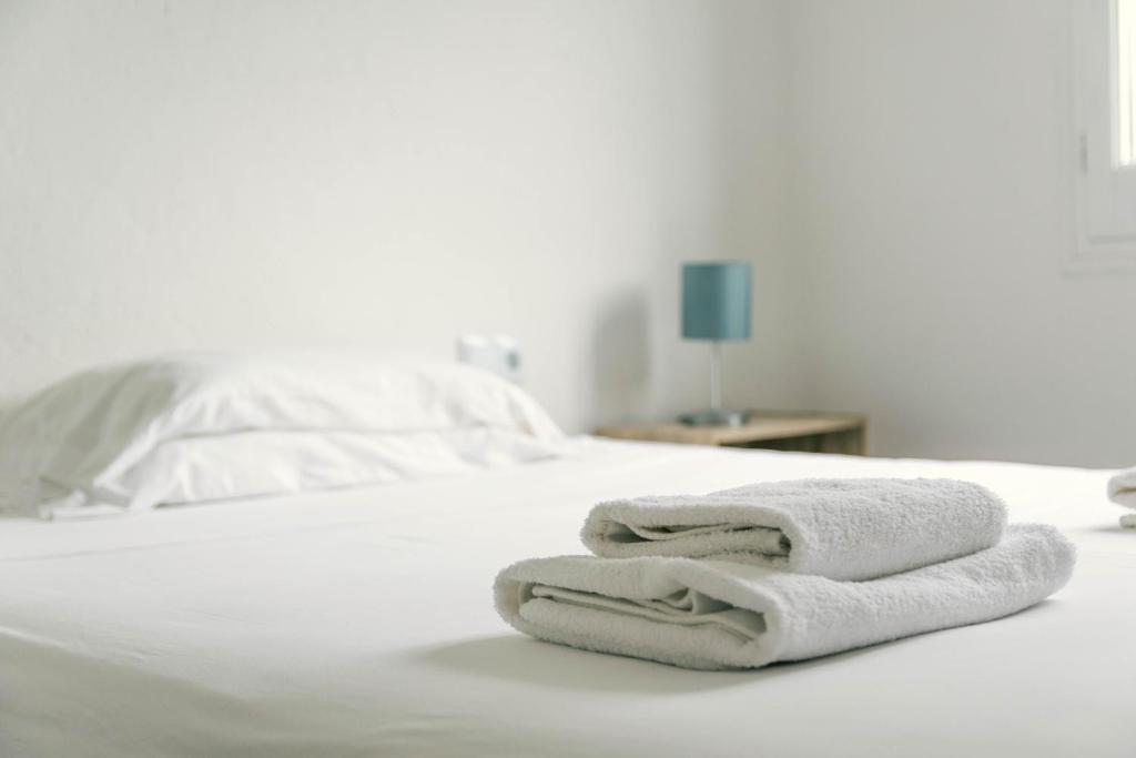 Posteľ alebo postele v izbe v ubytovaní Apartaments Falcó