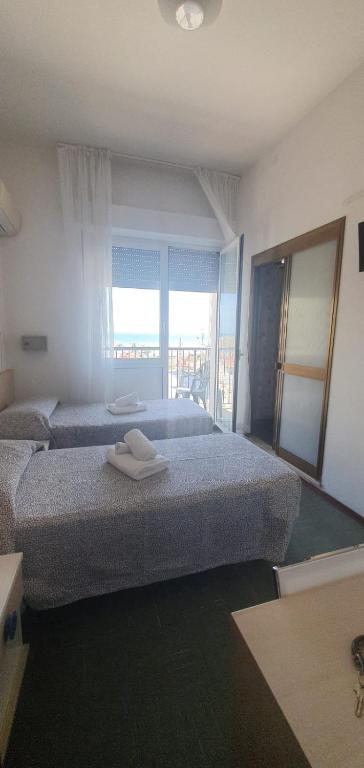 Postel nebo postele na pokoji v ubytování HOTEL VENUS