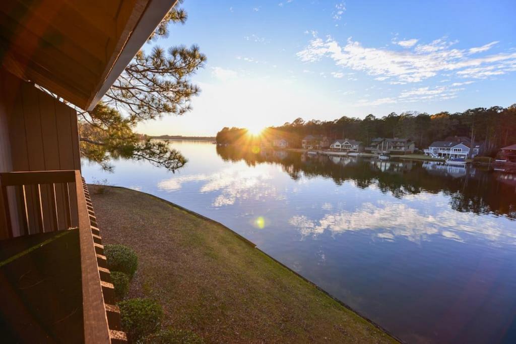 a house with a view of a river with the sunset at Mileys Place at Pinehurst in Pinehurst