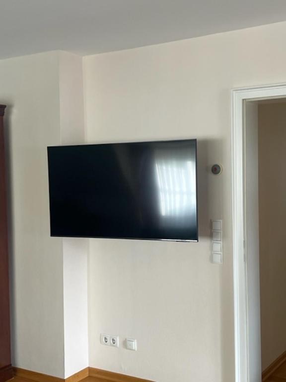 TV a/nebo společenská místnost v ubytování Dünenhaus