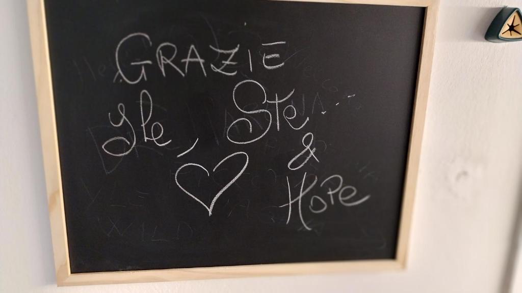a chalkboard with the words garage be safe and a heart at Drè Marèna in Rimini