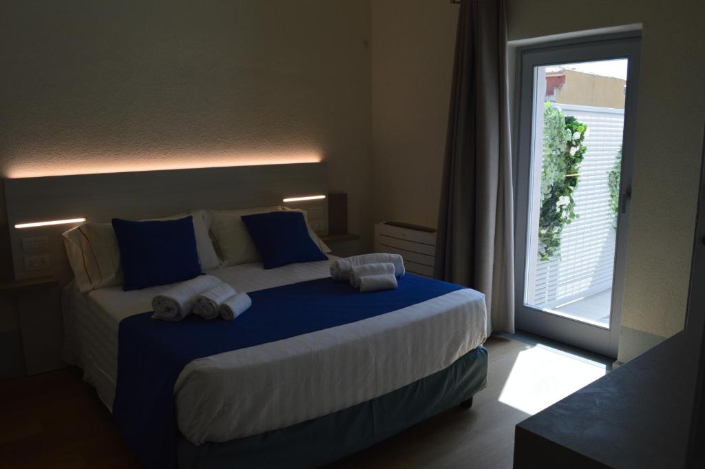 Postel nebo postele na pokoji v ubytování TANIT ROOMS & SPA