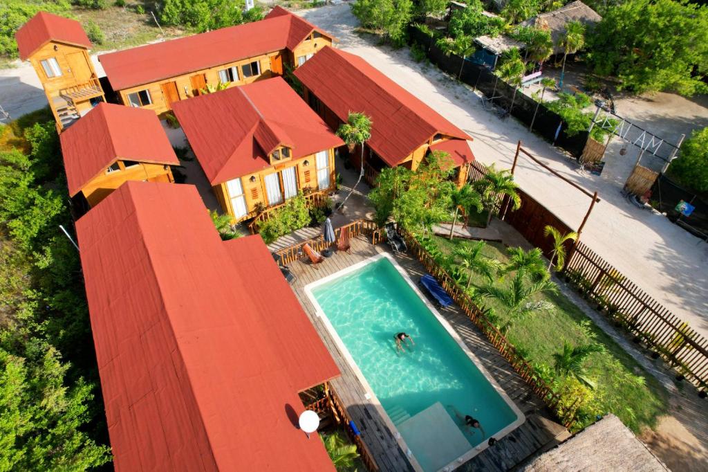 an aerial view of a house with a swimming pool at Anicca Aldea in Holbox Island