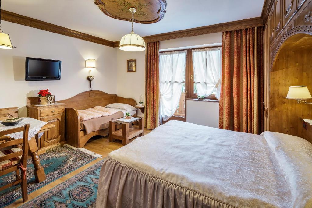 Łóżko lub łóżka w pokoju w obiekcie Hotel Columbia & Spa