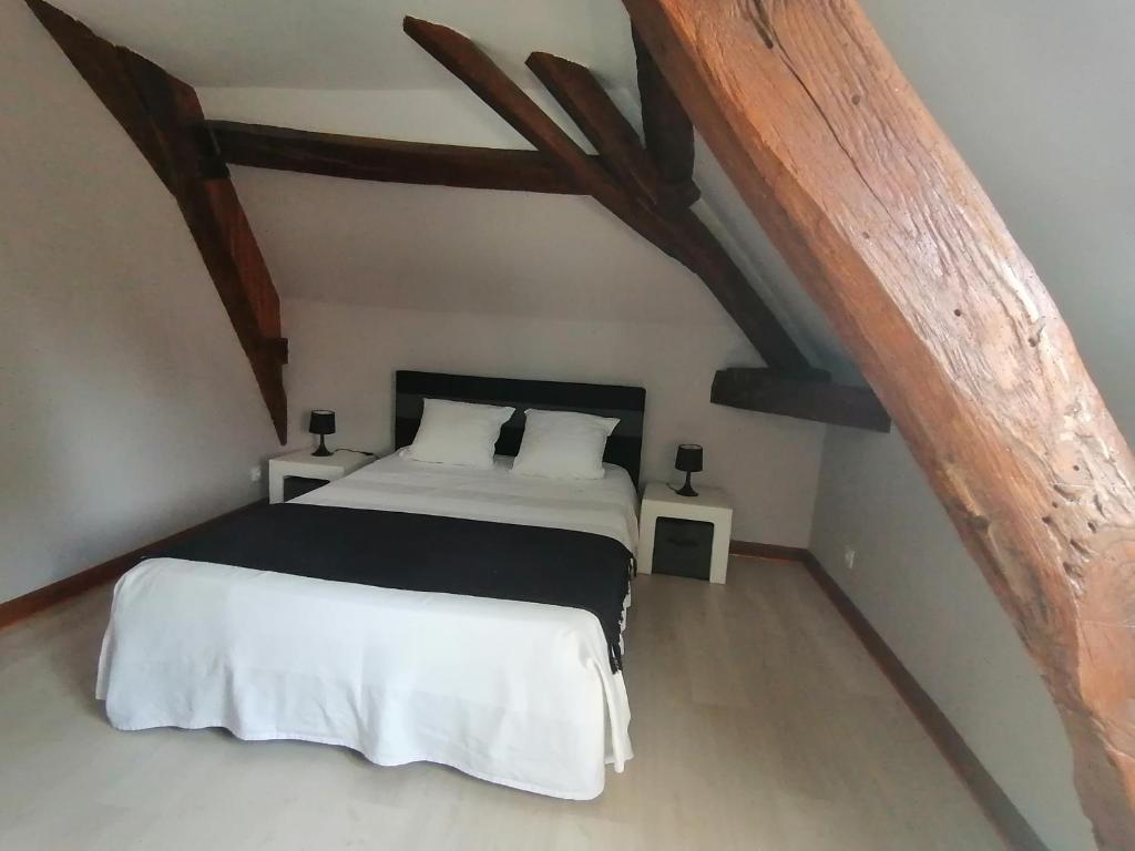 Ліжко або ліжка в номері Maison de ville - proche Le PAL