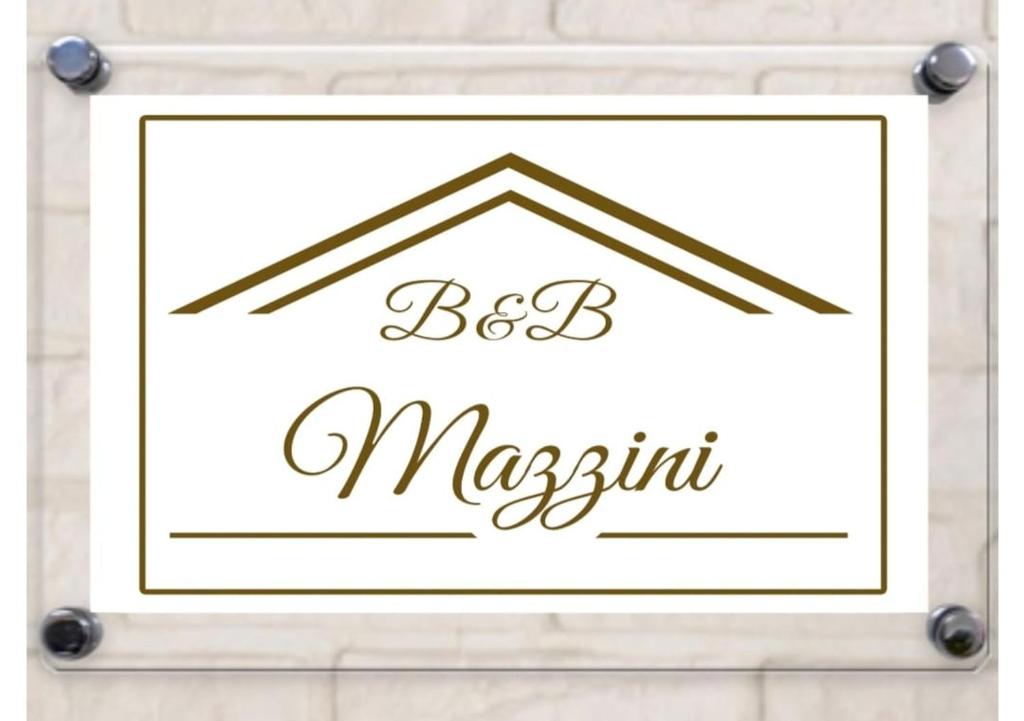 Ein Schild, auf dem "Beste Magnolie an einer weißen Wand" steht. in der Unterkunft B&B Mazzini in Grottaglie