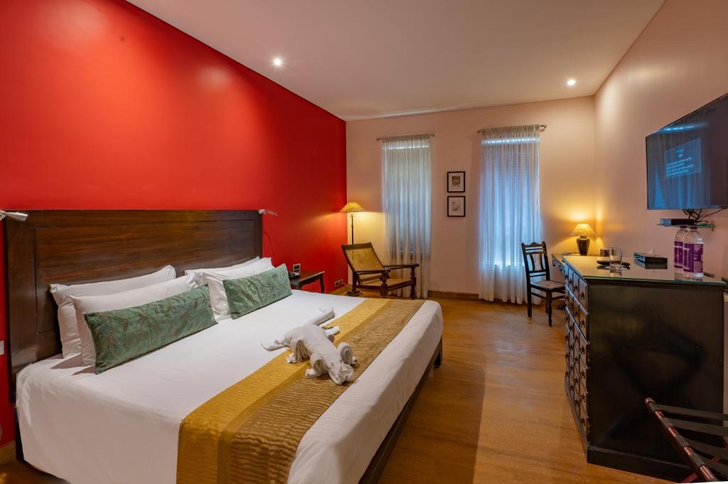 Postel nebo postele na pokoji v ubytování O Hotel Goa, Candolim Beach
