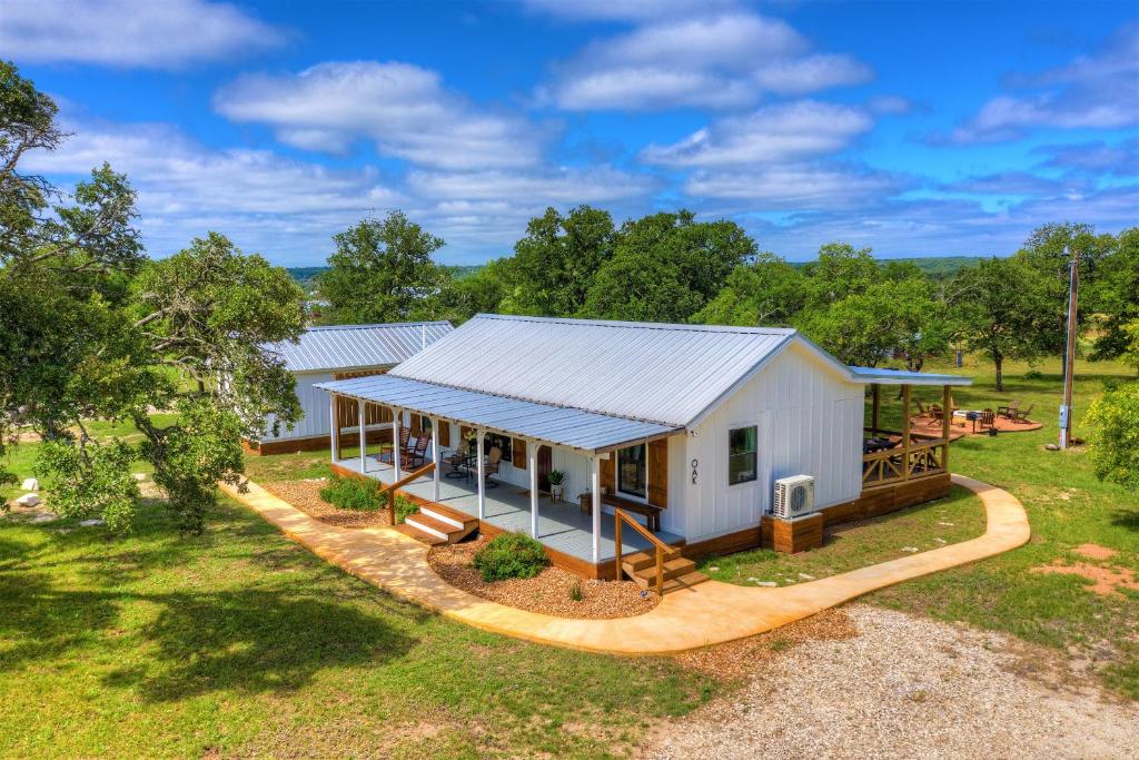 an overhead view of a white house with a porch at 3 Acres of Luxury and Views in Fred Wine Country! in Fredericksburg