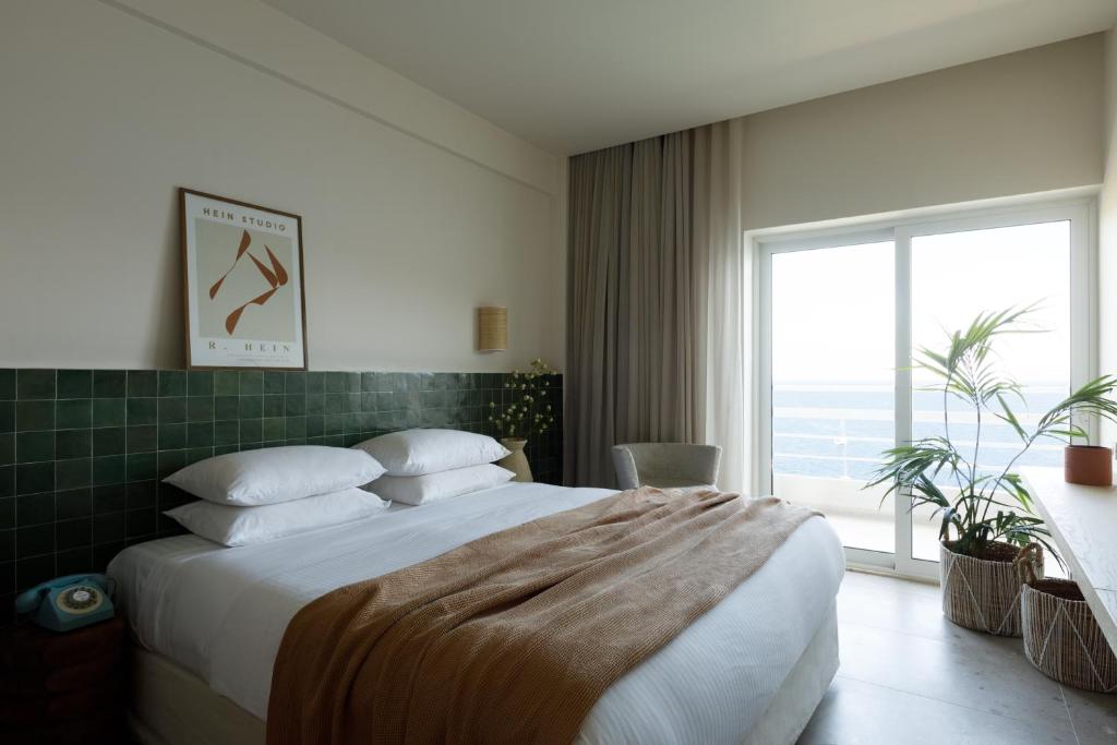 Postel nebo postele na pokoji v ubytování Sirene Blue Luxury Beach Resort