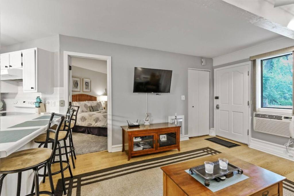 a living room with a kitchen and a dining room at Early check in- late check out Free day! in Lake Geneva