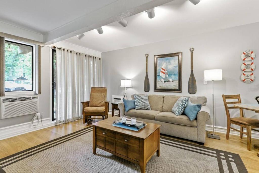 a living room with a couch and a table at Early check in- late check out Free day! in Lake Geneva