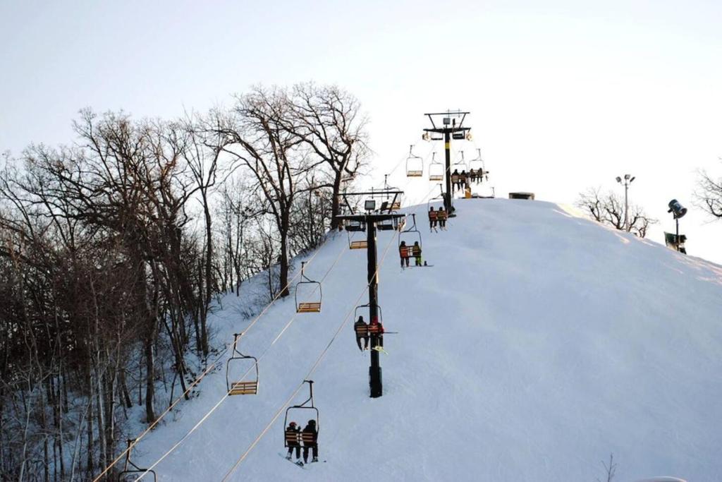 a ski lift going up a snow covered hill at Early check in- late check out Free day! in Lake Geneva