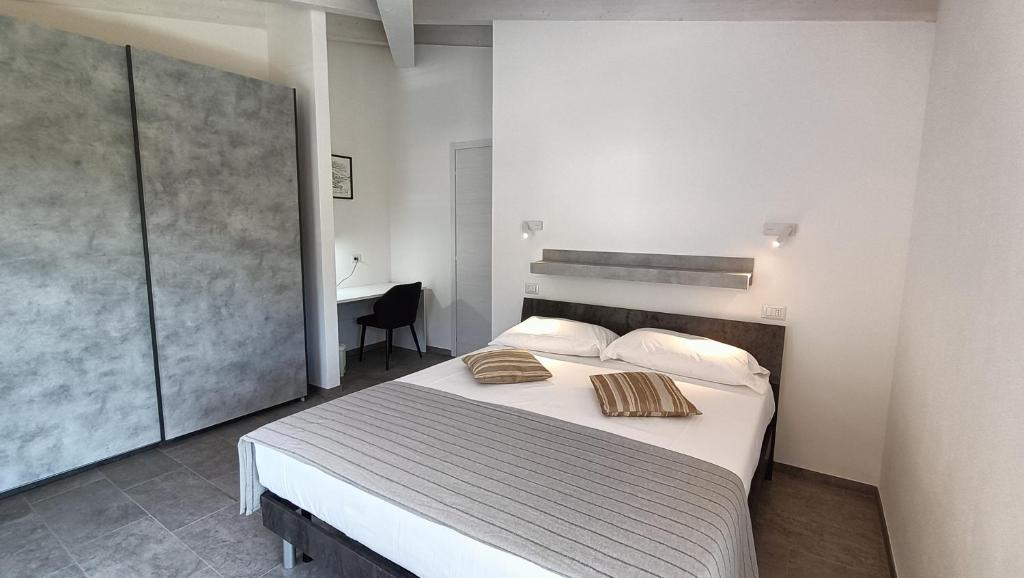 Postel nebo postele na pokoji v ubytování Margherite - Larihome A36
