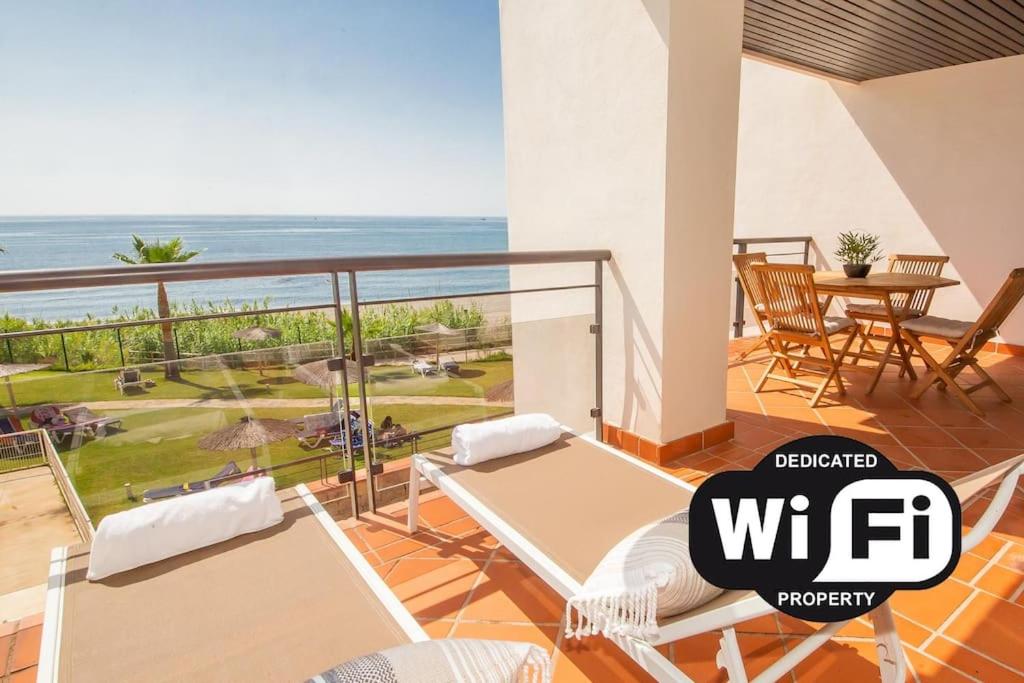 a room with a balcony with a view of the ocean at Casares del Mar D1 9 in Casares