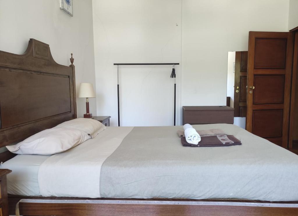 a bedroom with a large bed with a phone on it at DISCOVER PORTO - Boavista in Porto