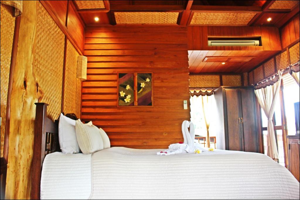 Postel nebo postele na pokoji v ubytování Pai Vimaan Resort