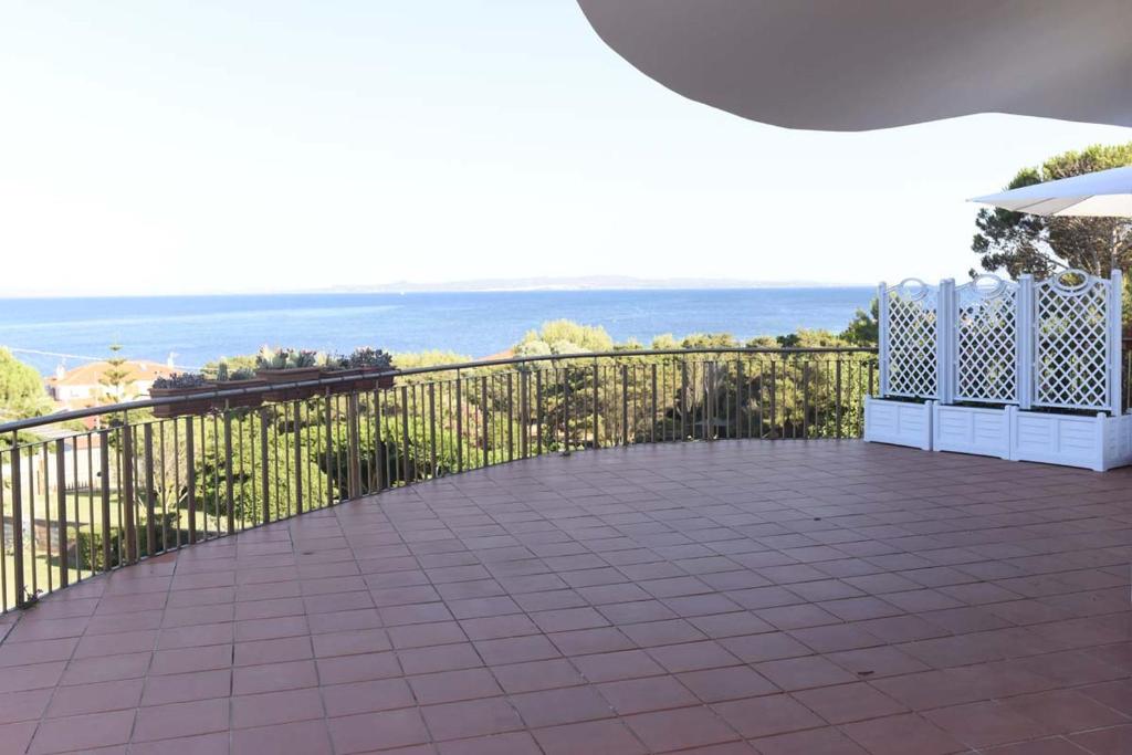 a balcony with a view of the ocean at Villa Elicriso in Carloforte