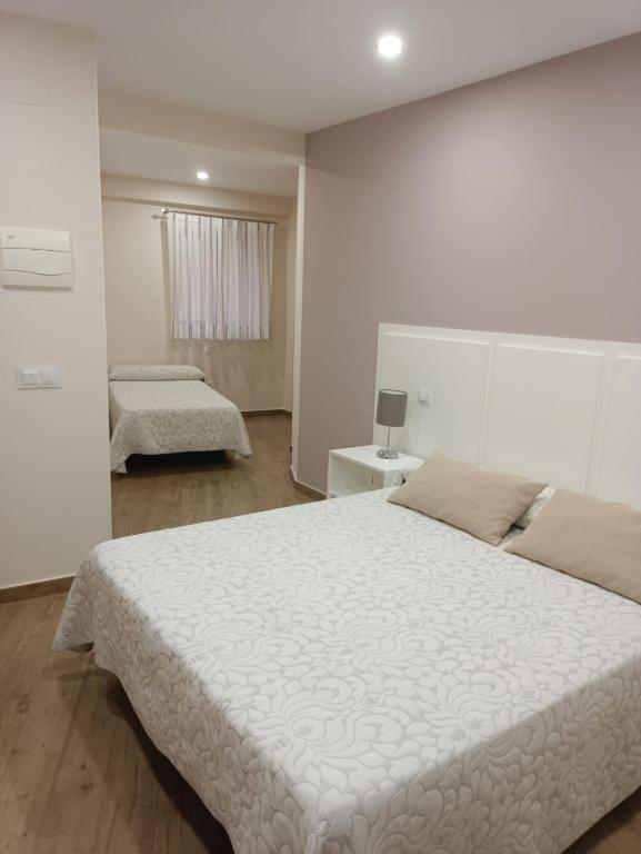 Posteľ alebo postele v izbe v ubytovaní Hostal Infantes