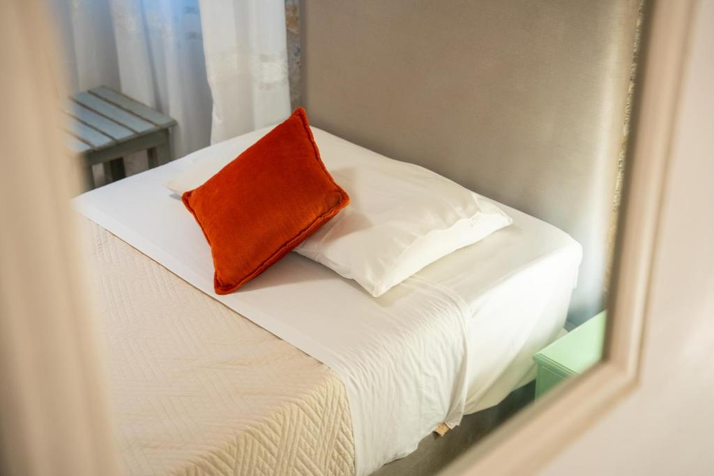 Postel nebo postele na pokoji v ubytování Piccolo Paradiso