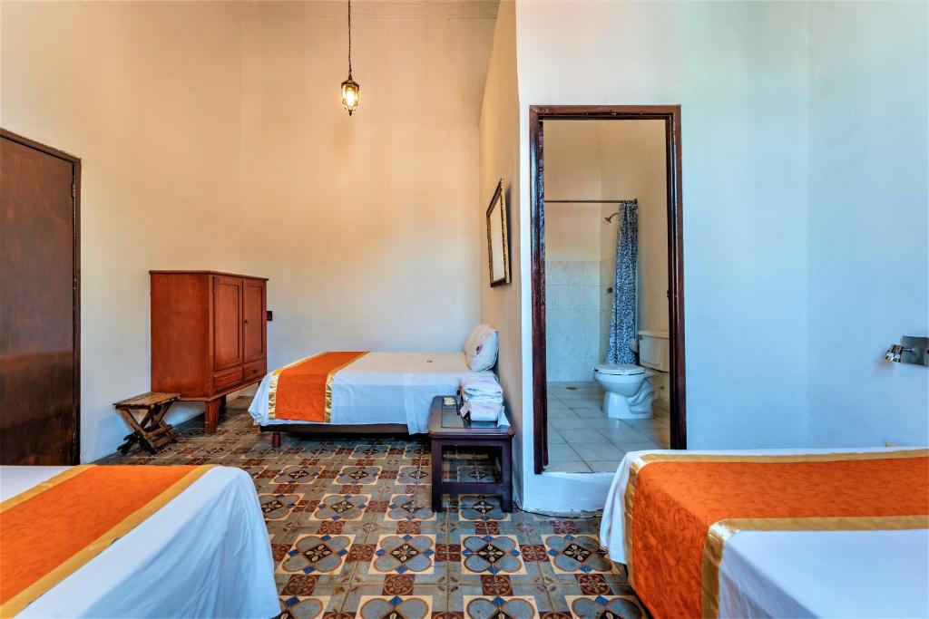 Postel nebo postele na pokoji v ubytování Hotel Gran Centenario