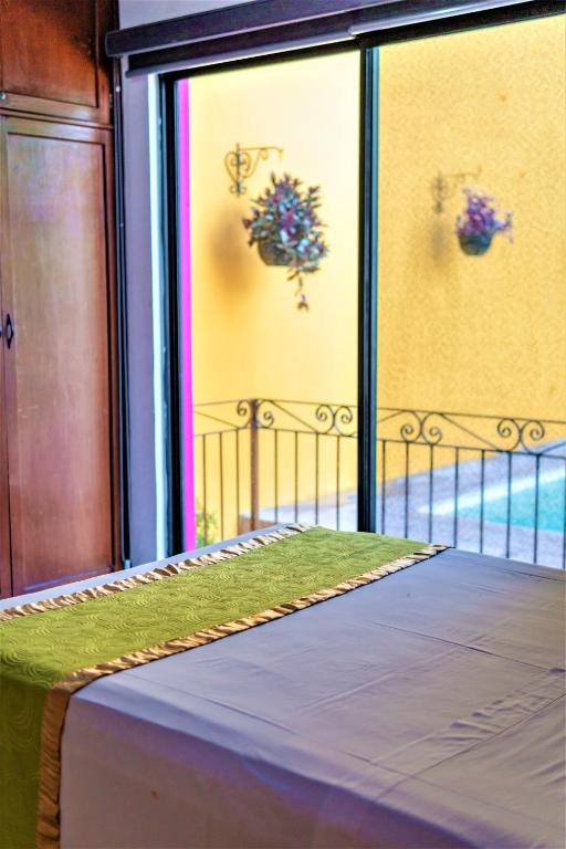 Postel nebo postele na pokoji v ubytování Hotel Gran Centenario
